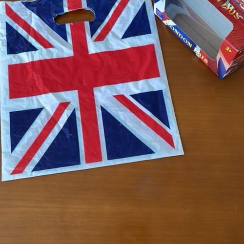 Plastic bag with English flag and small empty London bus box like new