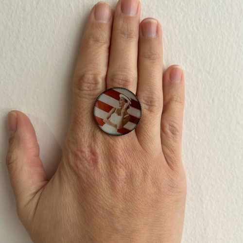 Ring used with printed woman in swimsuit design