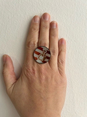 Ring used with printed woman in swimsuit design