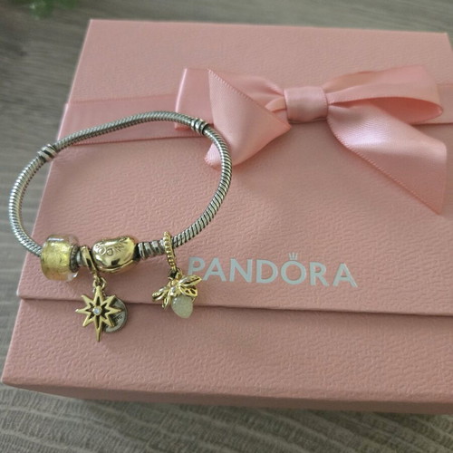 Pandora authentic bracelet like new with 3 gift charms silver and gold