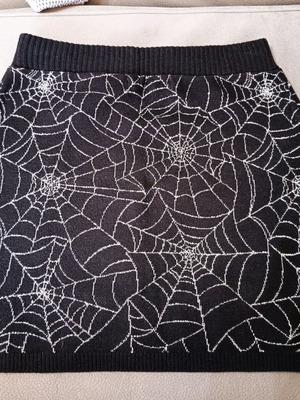 Knitted skirt with silver thread like new, size 6-8, H&M