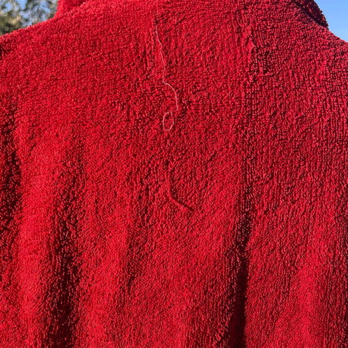 Das bathrobe used, red color, with front pockets