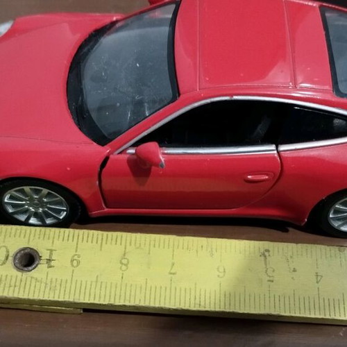 Collectible Porsche Carrera toy car with opening doors like new