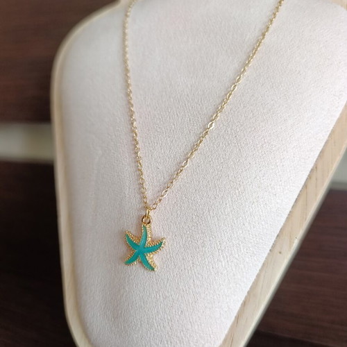 Starfish necklace in stainless steel, like new, gold color