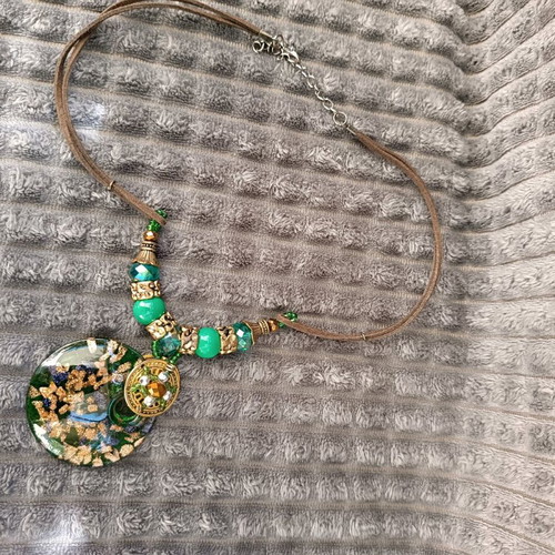 Necklace with green beads and glass pendant used