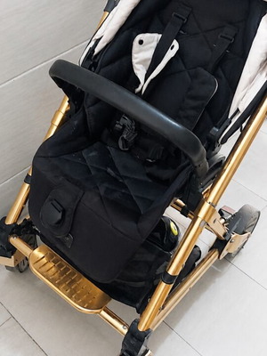Mamas & Papas baby stroller with some wear on wheels and canopy