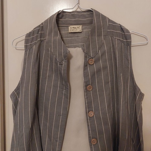 Namaste vest with beige pants like new