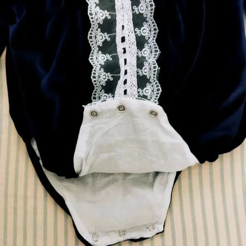 Caramelo kids romper used for 6-9 months with white embroidered details