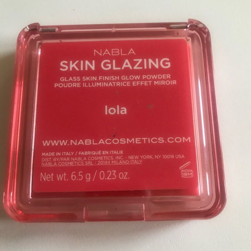 Nabla skin glazing blush lightly used, bright peach pink highlighter