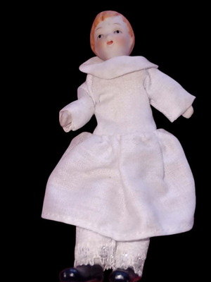 Small ceramic doll used, about 11.5 cm