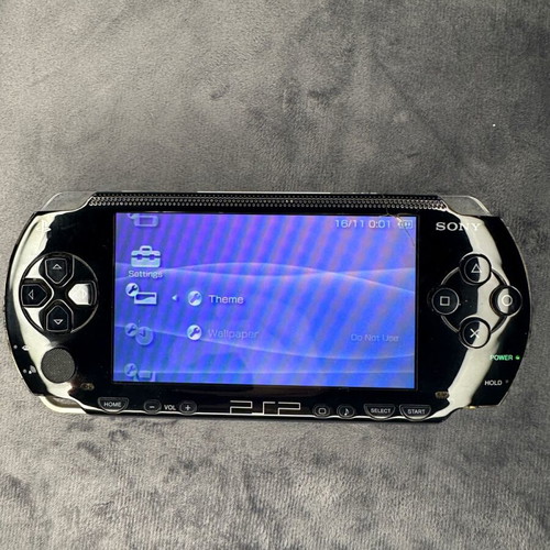 PlayStation Portable PSP-1000 used with charger, 5 games, and Memory Stick