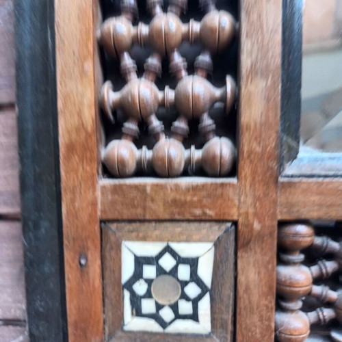 Vintage bijouterie mirror with wooden ornate frame