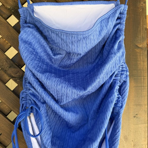 Blue swimsuit like new with adjustable side cords, draped bust, regular cut