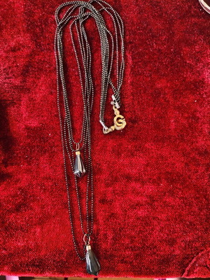 Long necklace used with black beads and hematite pendants