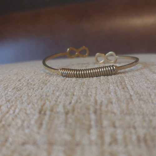 Gold infinity handcuff bracelet like new
