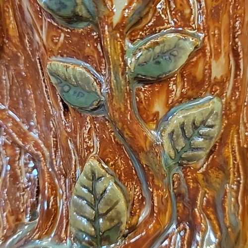 Handmade ceramic vase with natural decorative elements