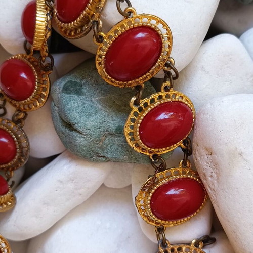 Vintage necklace used with red stones and brass metal