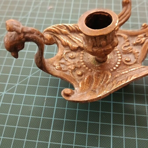 Bronze candlestick used, baroque style with embossed decoration