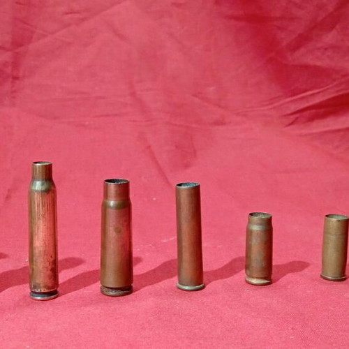 Empty deactivated cartridge cases used, various calibers including M-230 from AH-64 Apache