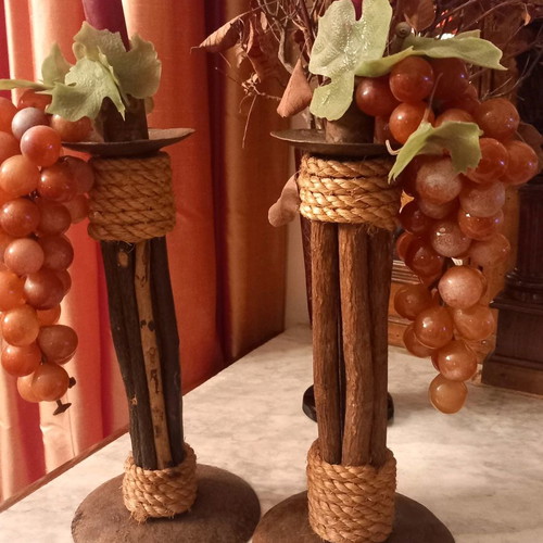 Handmade candlesticks used, set made of branches, rope and metal