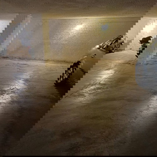 Underground parking space with car elevator, Athens Three Bridges