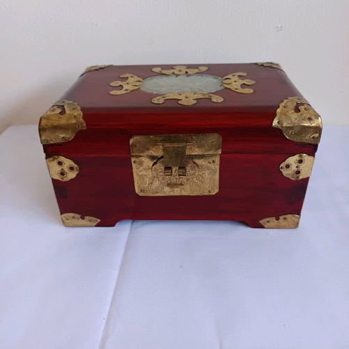 Wooden jewelry box used with brass decorative elements