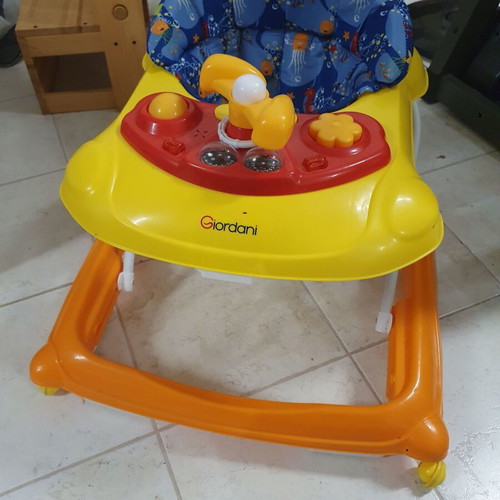 Baby walker like new with toys and comfortable seat