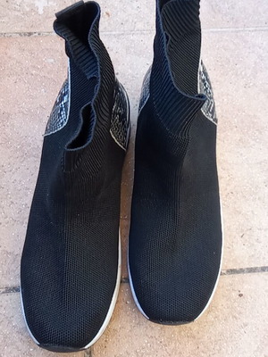 Women's sock-style boots like new, black with snake pattern