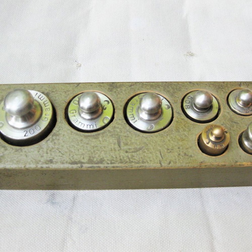 Set of old brass weights used with case