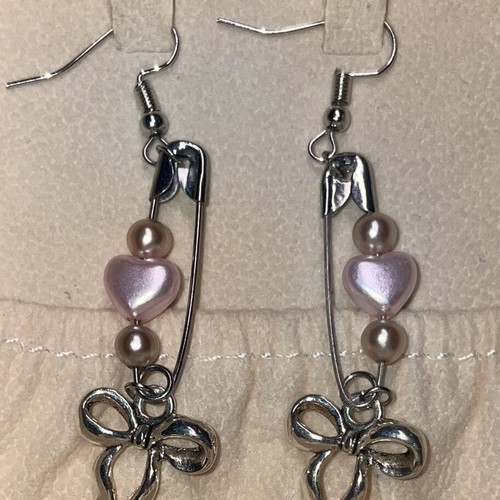 Silver earrings with bows and pink hearts, new