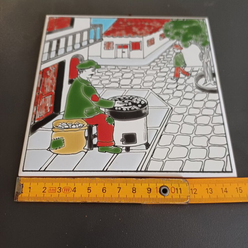Ceramic tile decorative with traditional chestnut seller, like new