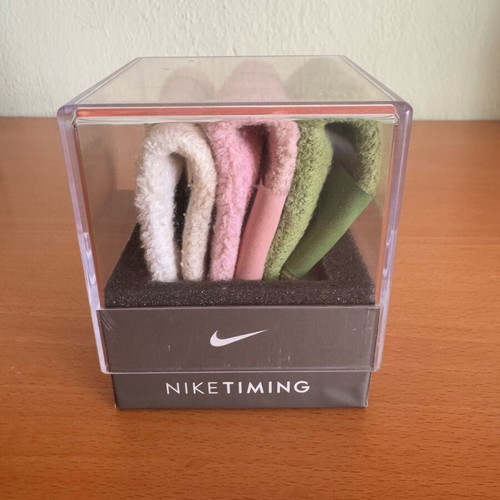 Nike sports watch used with white, green and pink wristband
