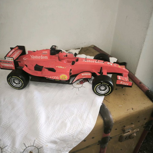 Formula 1 toy car with friction and sounds, red, like new