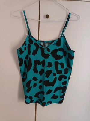 Animal print blouse with adjustable straps like new