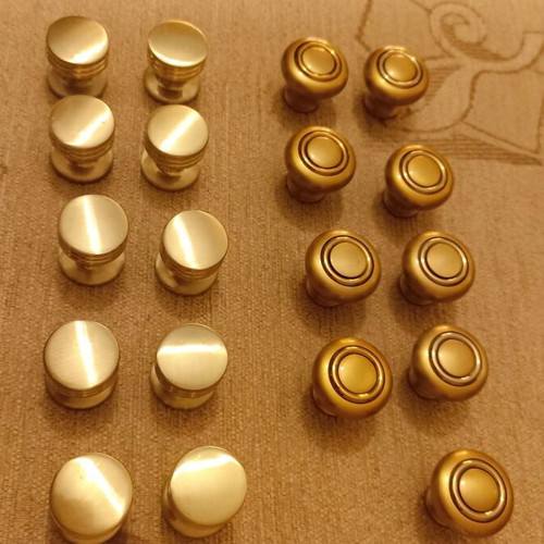 Handles and knobs for cabinets and drawers used, 24 pieces gold and silver