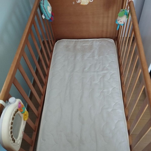 Baby cot used with mattress and adjustable height