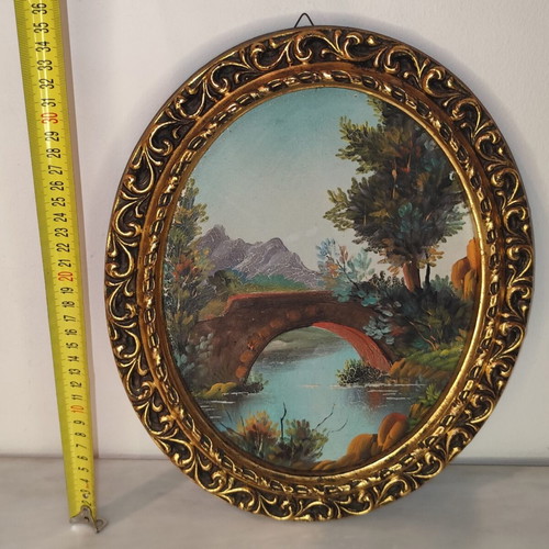 Oval vintage painting on canvas with golden frame used