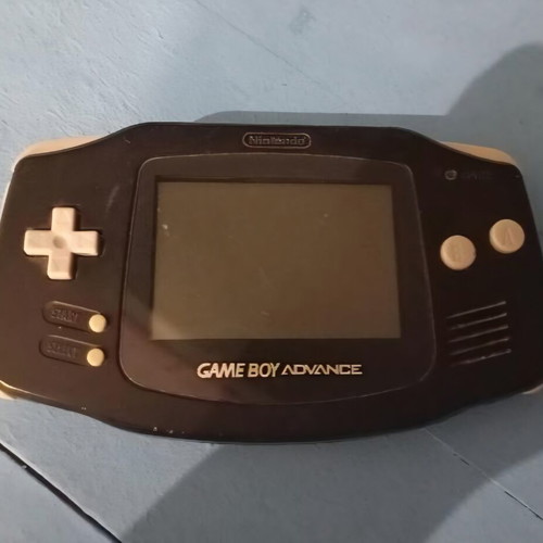 Nintendo Game Boy Advance console with Super Mario 3 cartridge