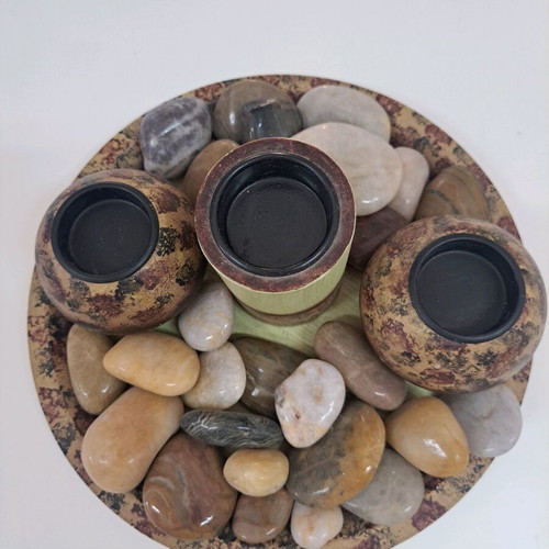 Tray with wooden candlesticks and colorful stones like new