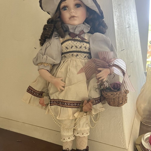 Porcelain doll with hat and basket, 52 cm