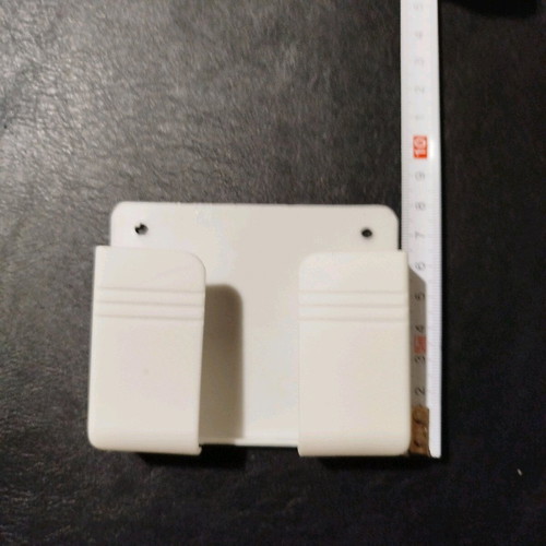 Mobile phone charging holder new, white PVC, fits phones up to 9 cm