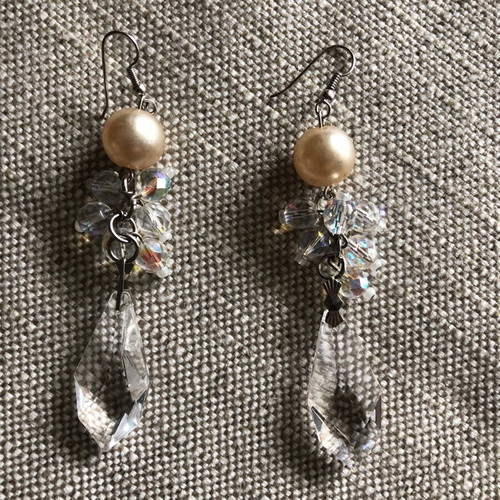 Evening earrings used with beige pearl and crystals