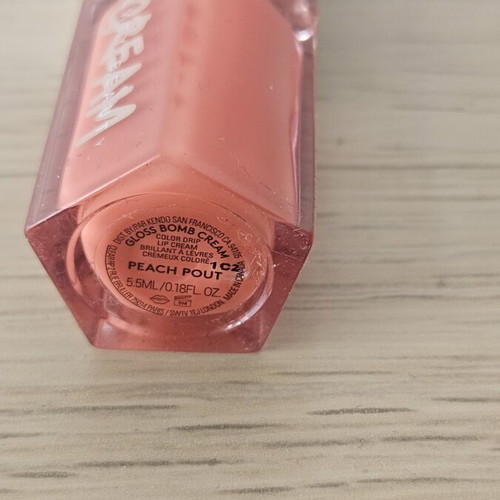 Fenty Beauty Mini Lip Gloss coral shade, almost full