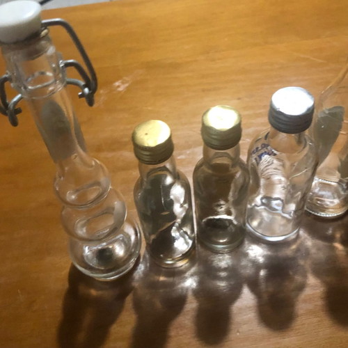 Glass miniature bottles used, pack of 7, vintage spirit collection