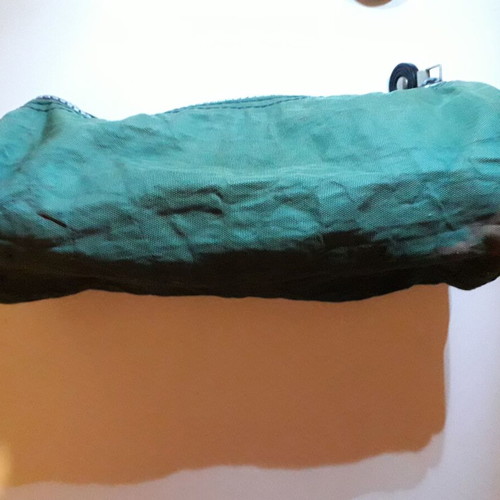 Pencil case used khaki color with ink marks