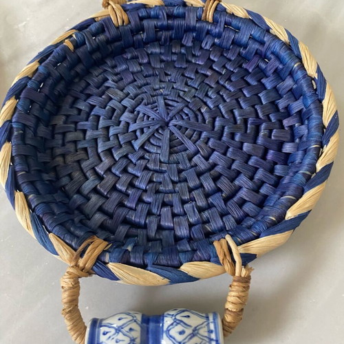 Blue handmade wicker basket with painted porcelain handles like new