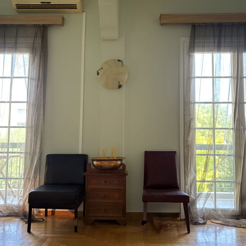 Brown sofa and green armchair furniture set