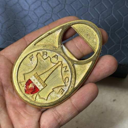 Vintage metal bottle opener Paris with embossed city crest, used
