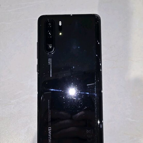 Huawei P30 Pro used with 5 cases, 2 headphones, charger, and box