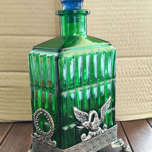 Vintage Italian glass bottle in metal base like new